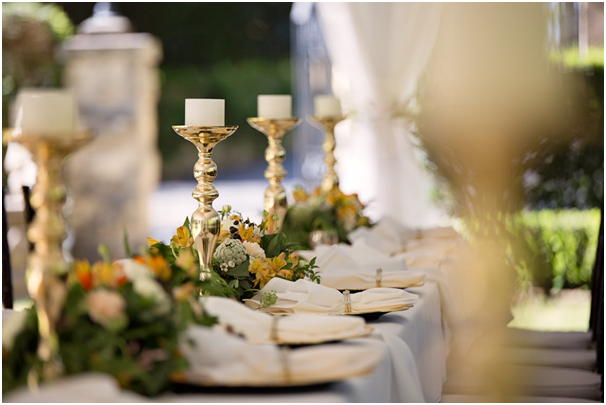 Elaborate Candlesticks Featuring Unlit Candles as a Lighting Option on a Head Table