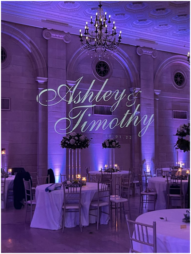 A Monogram Gobo for “Ashley and Timothy” with Purple Wedding Lighting