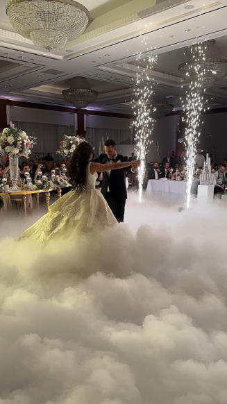 Wedding dance floor with colorful lighting effects and guests dancing
