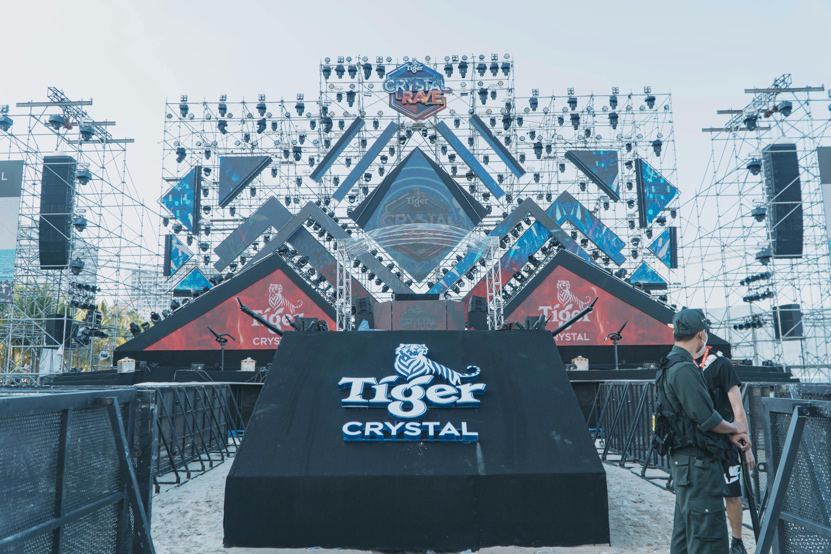 Modern trade show stage with lighting and branded stage wraps