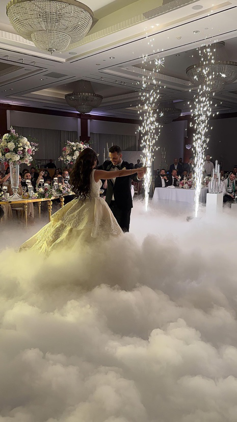 Wedding dance floor with colorful lighting and guests dancing