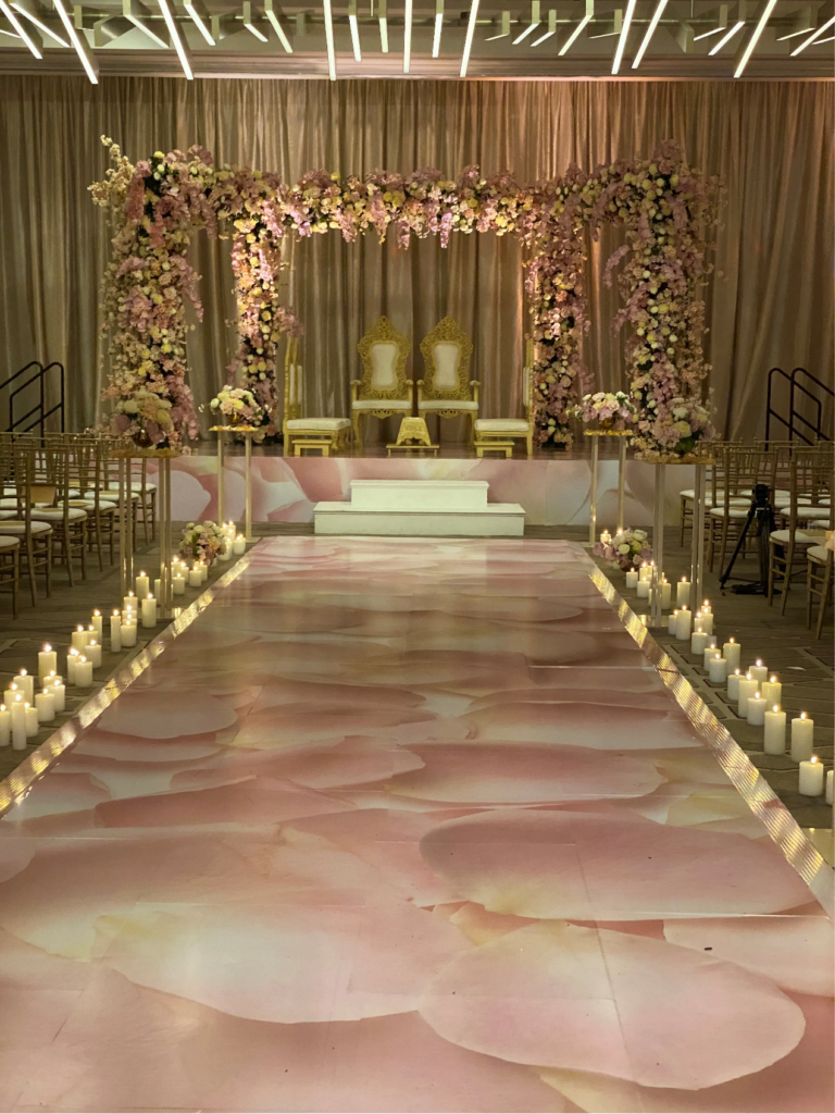  party themed stage with custom stage wrap and elegant event lighting setup