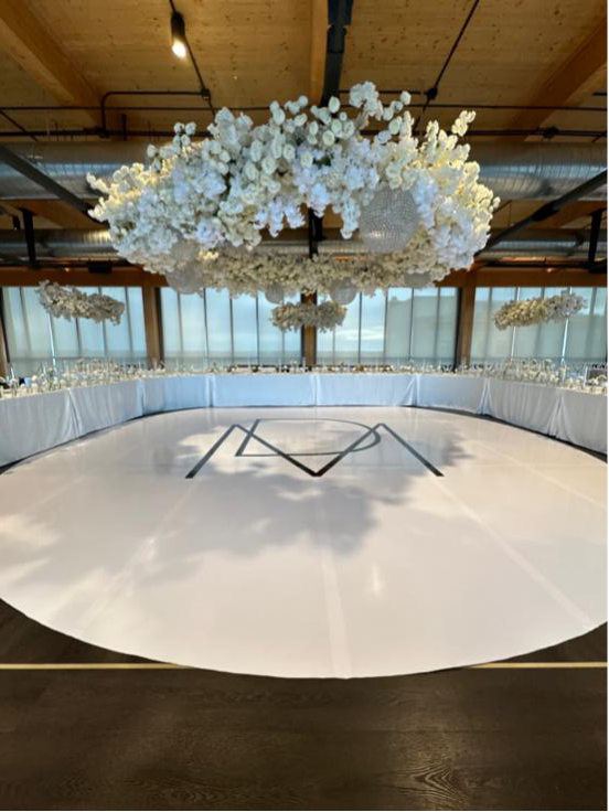 White wedding dance floor with custom monogram design