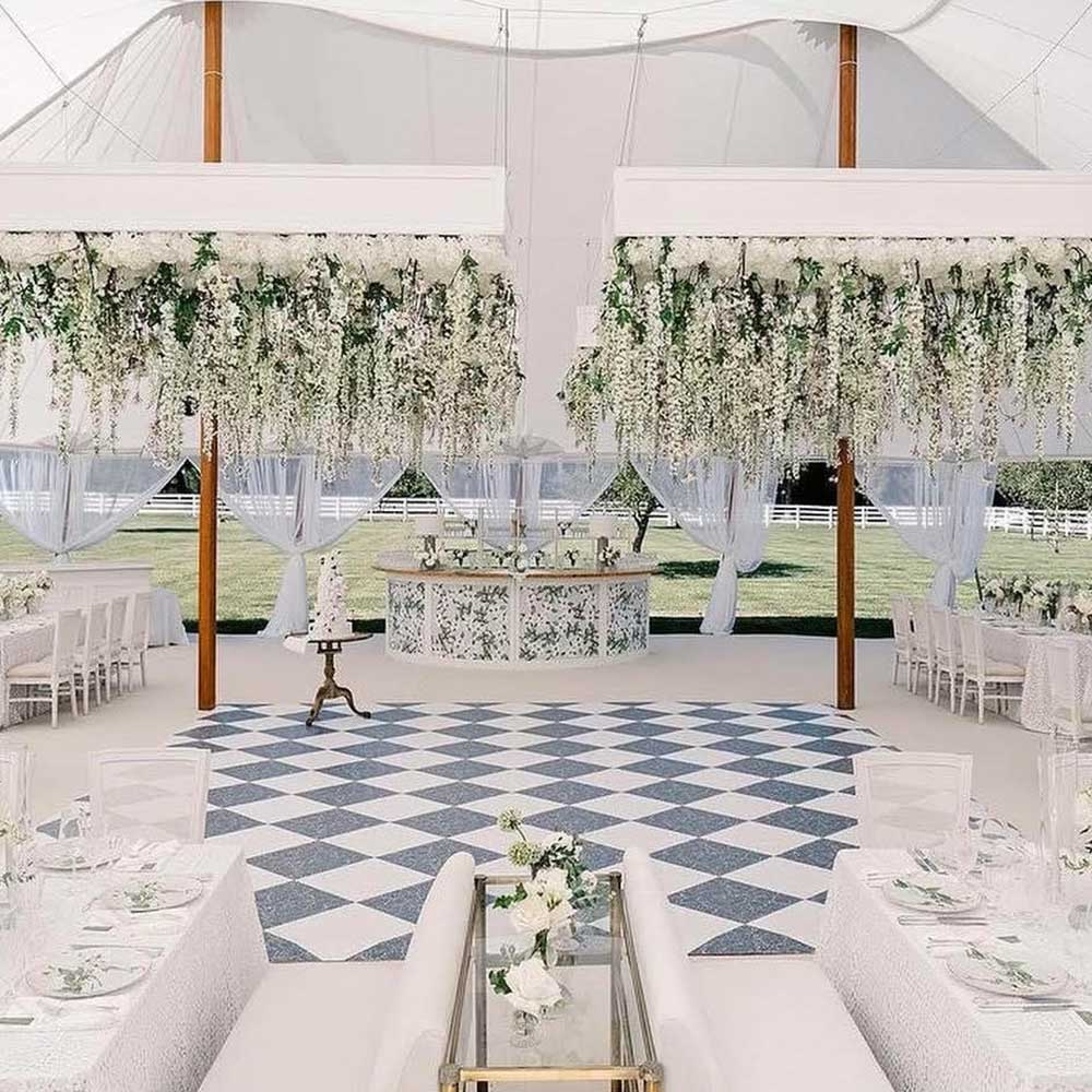 Black and white checkered dance floor at elegant wedding reception venue