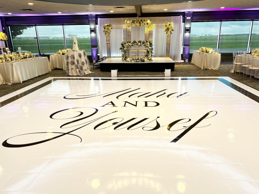 Black and white checkered dance floor at elegant wedding reception venue